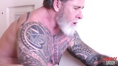 Tattooed DILF Deepthroats Hung Stud