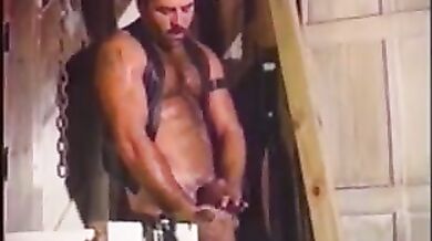 Gay man with big hard dong fucks his lover in fetish scene